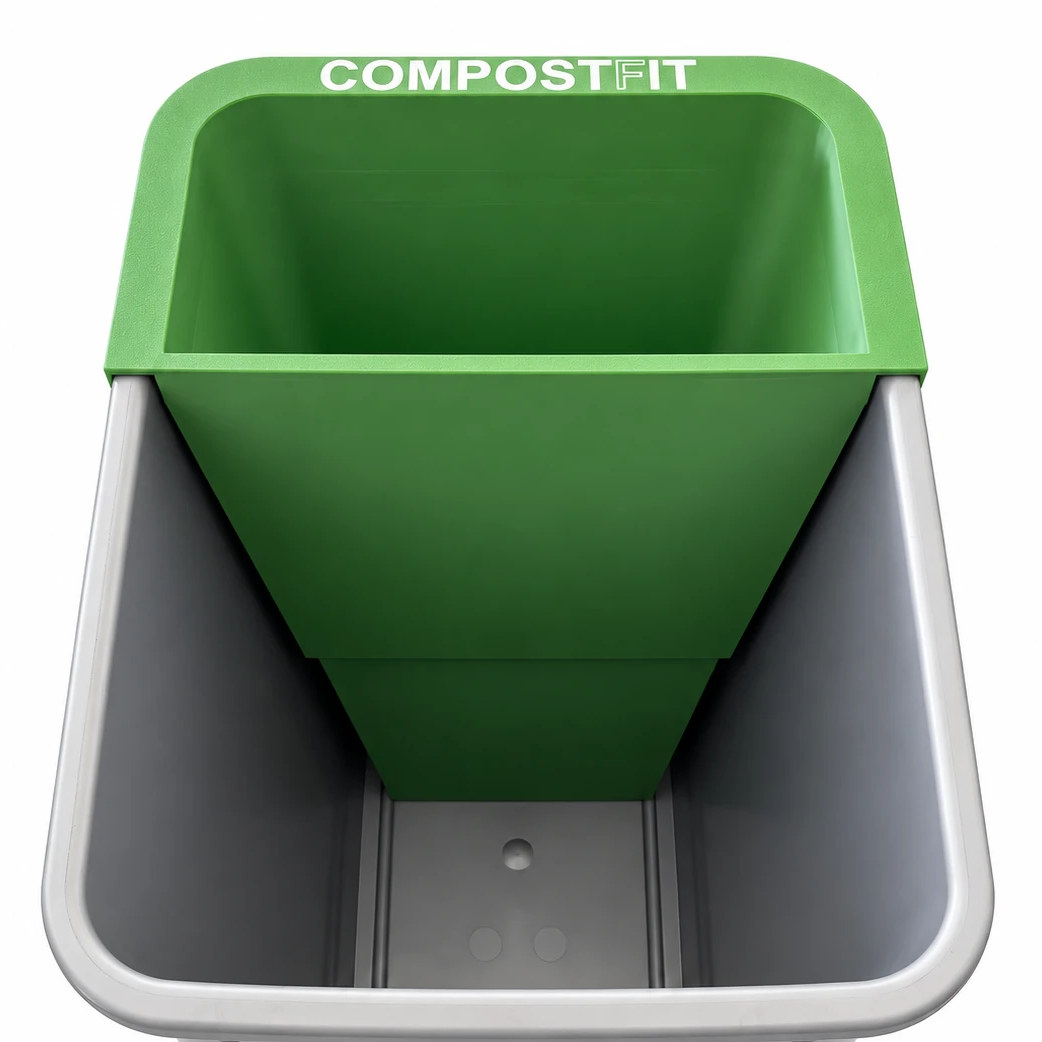 CompostFit set into an empty pull-out trash bin with no bag, its rim resting on the bin's edge and the bottom bin reaching toward the floor of the can